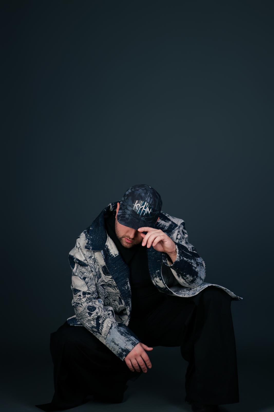 DJ KYHN with headphones at a live event in Phoenix, Arizona