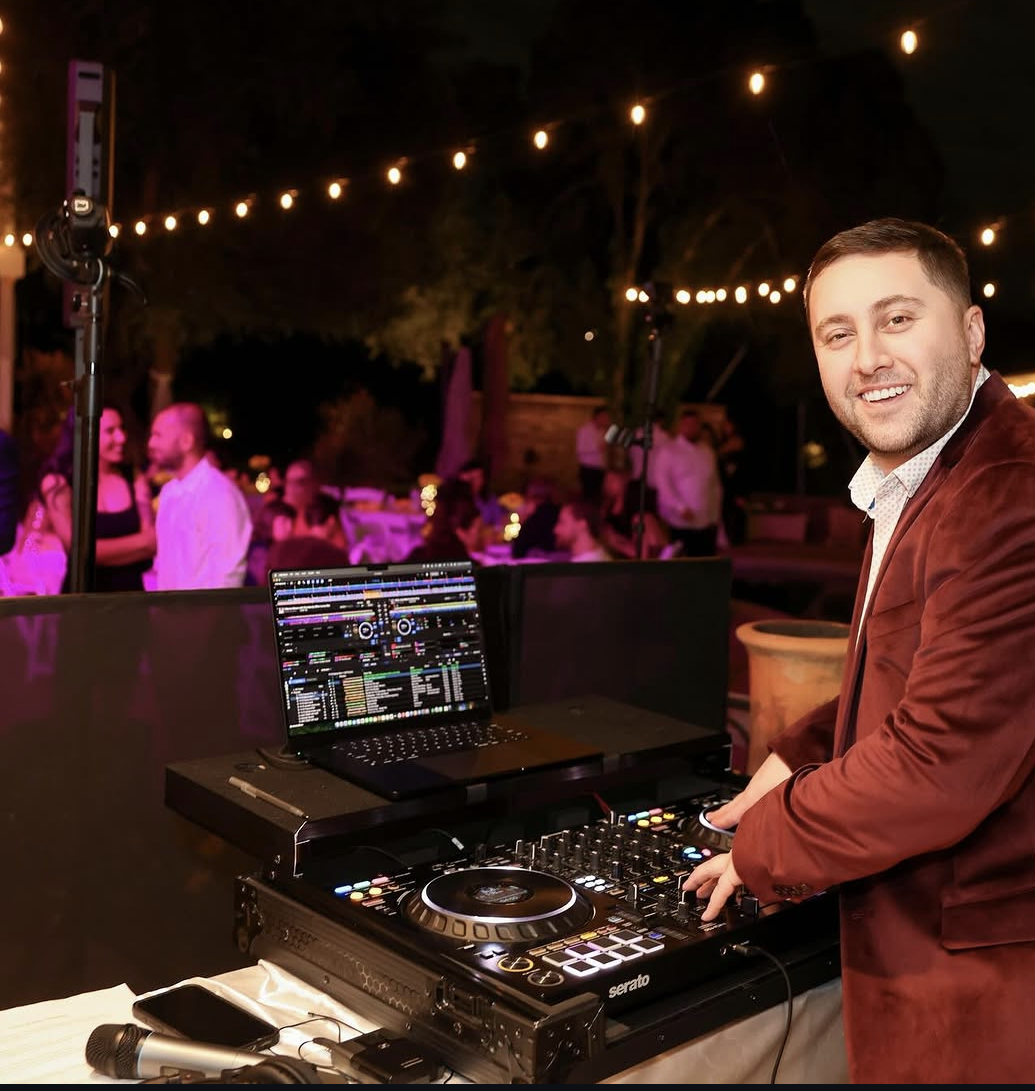 DJ KYHN headshot with headphones and KYHN branded cap